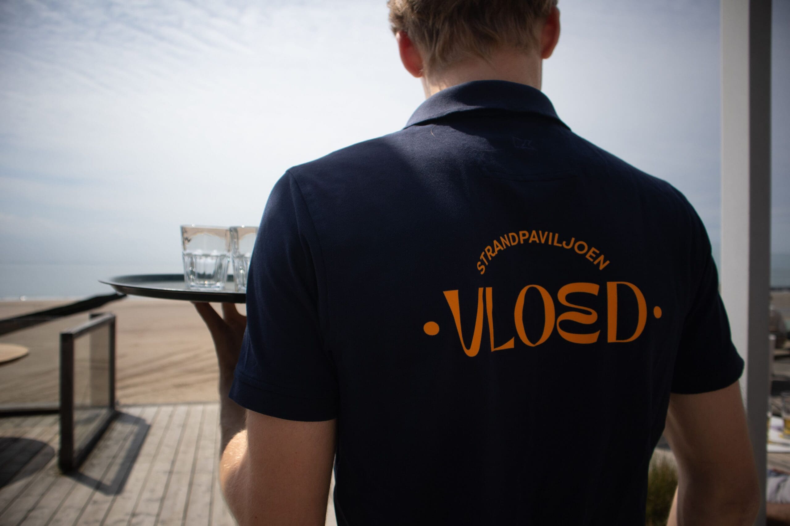 werkpolo met logo op de rug voor een restaurant